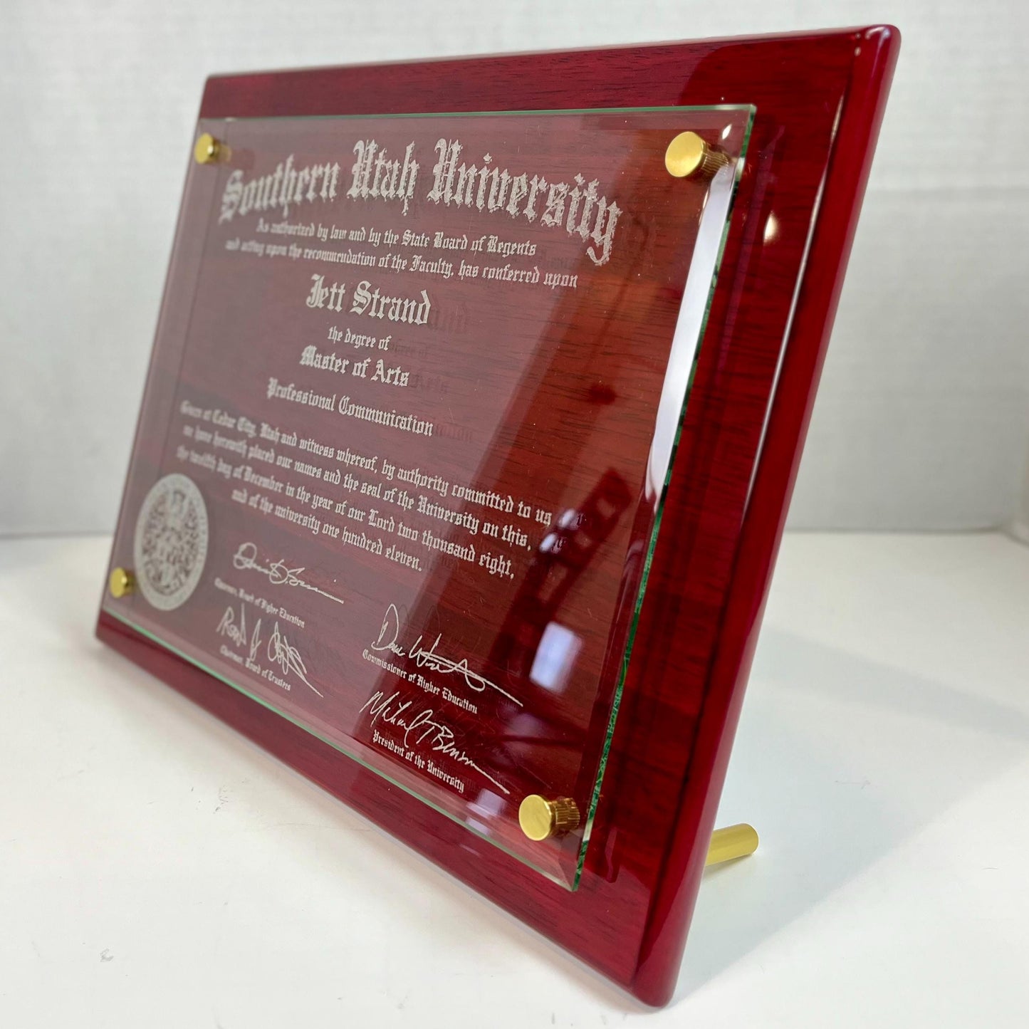 side angle of large red diploma plaque