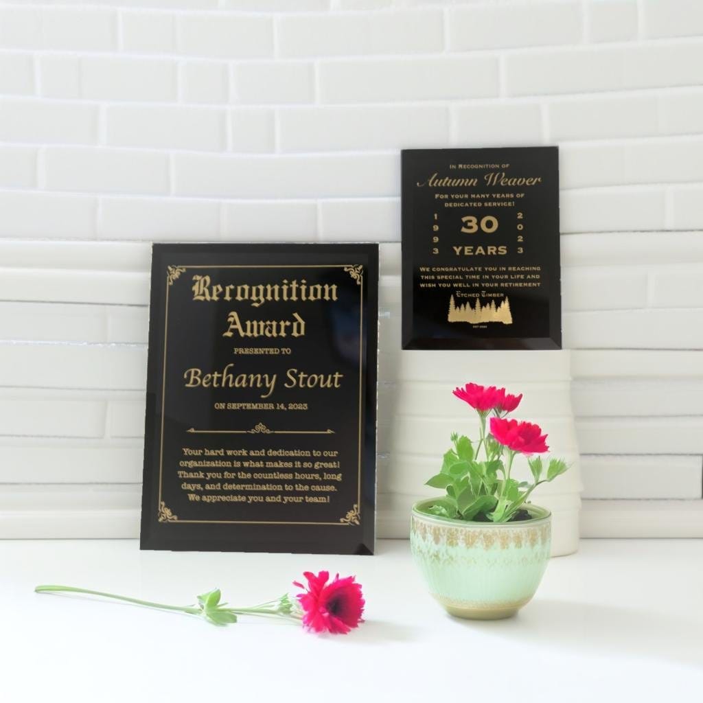black glass recognition award with gold writing