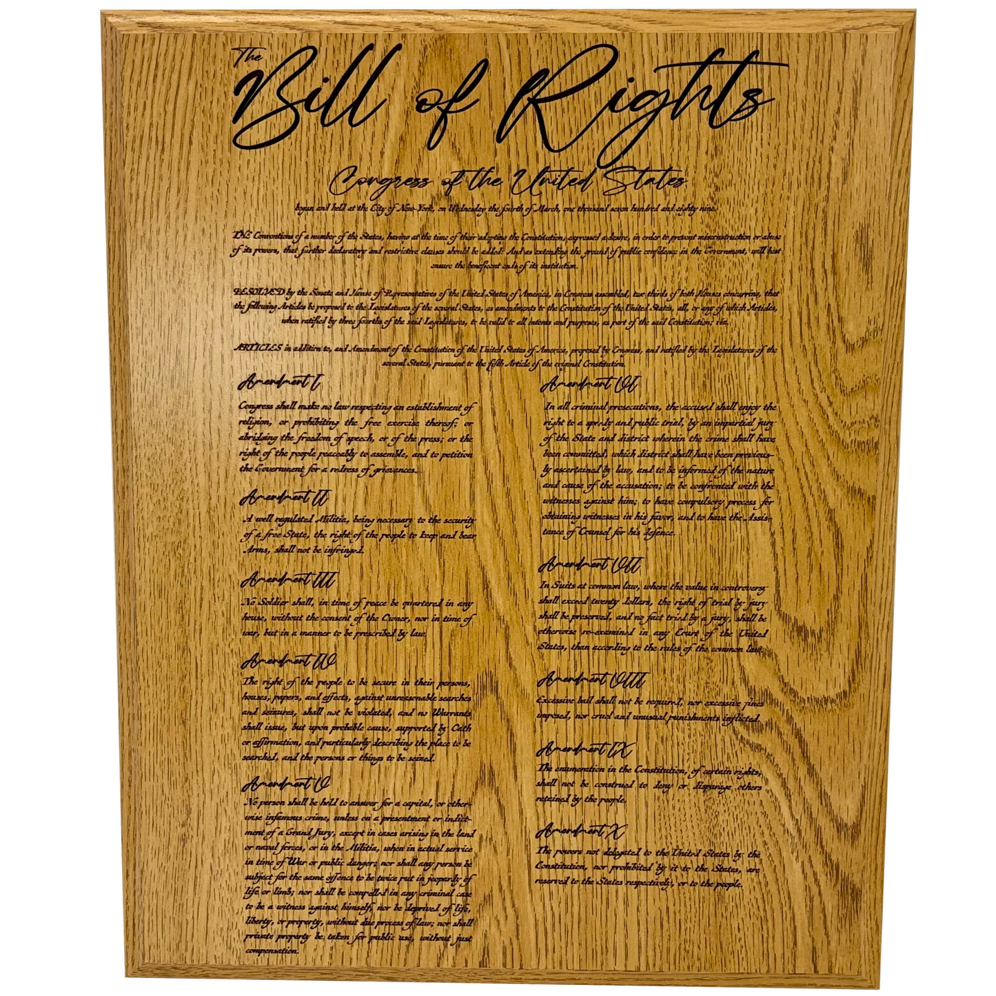 Wooden plaque with engraved text of the Bill of Rights on a white background