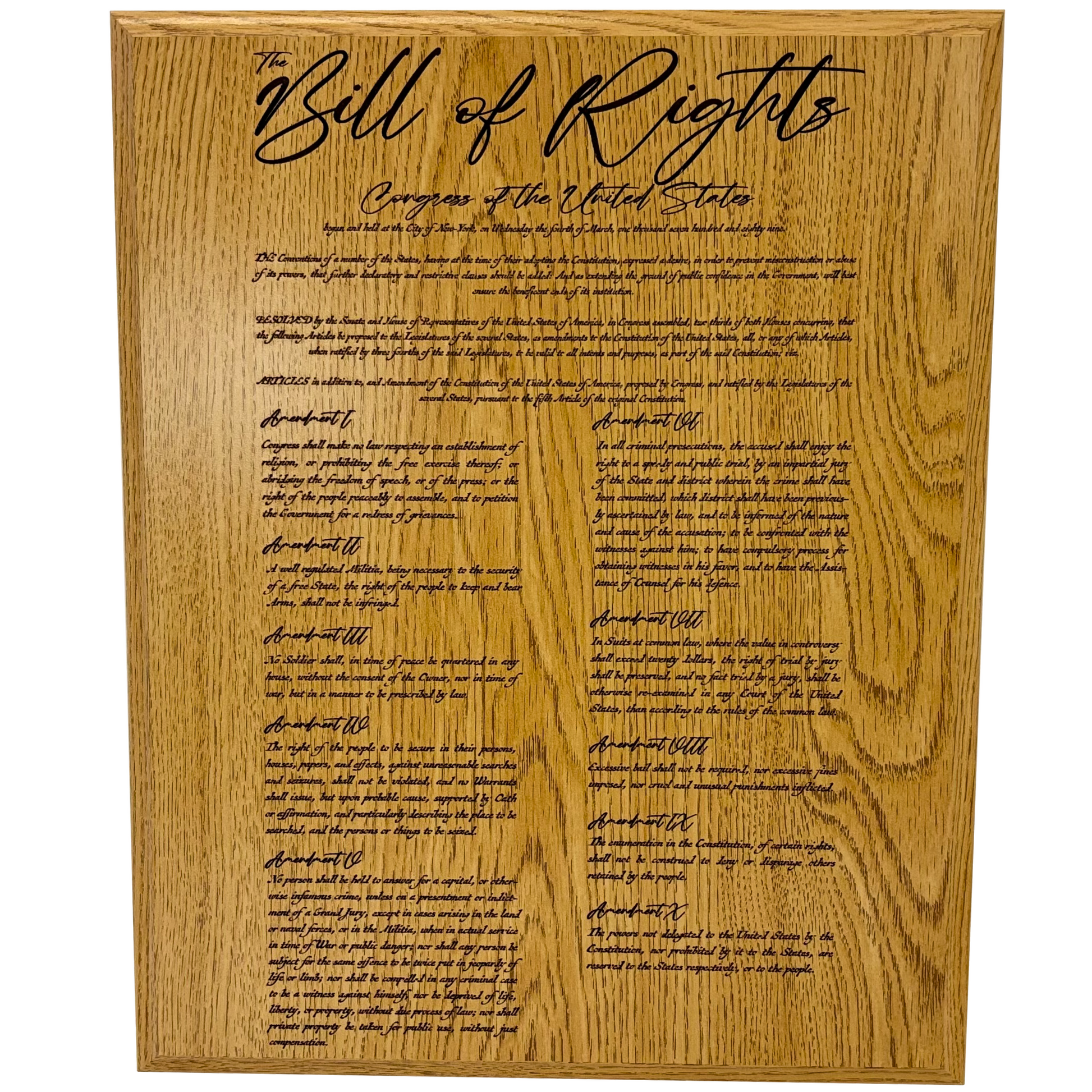 Wooden plaque with engraved text of the Bill of Rights on a white background