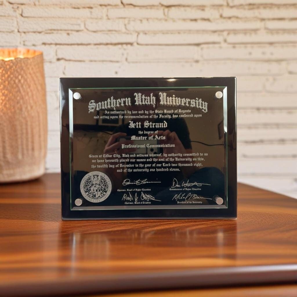 Floating Glass Diploma frame on wood table