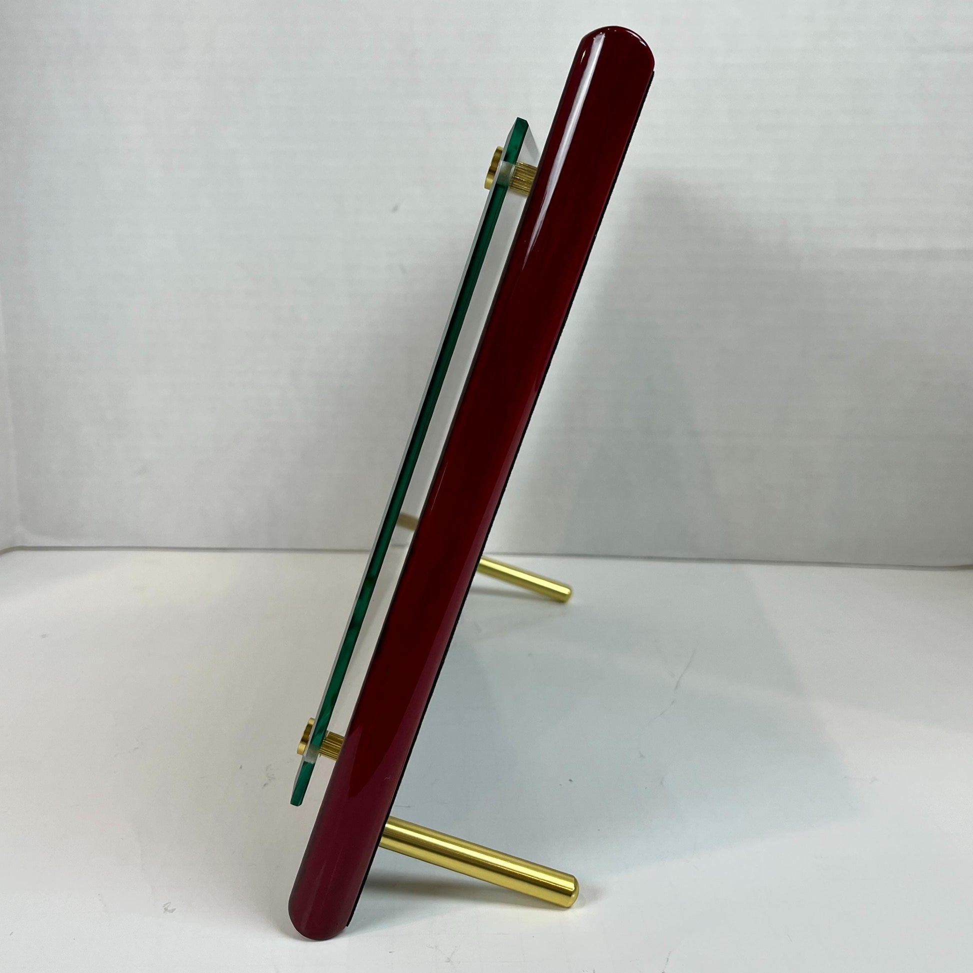 profile view of red floating glass frame