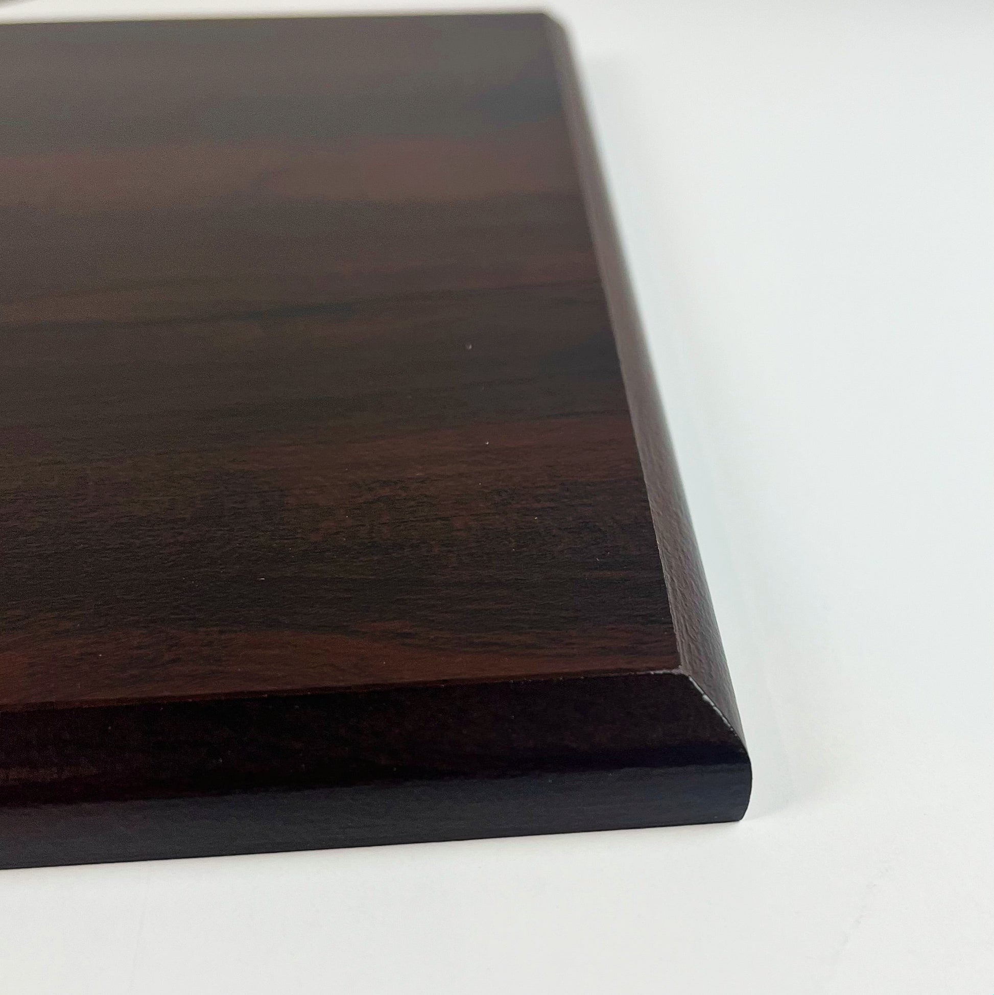 profile view of cherry finish plaque