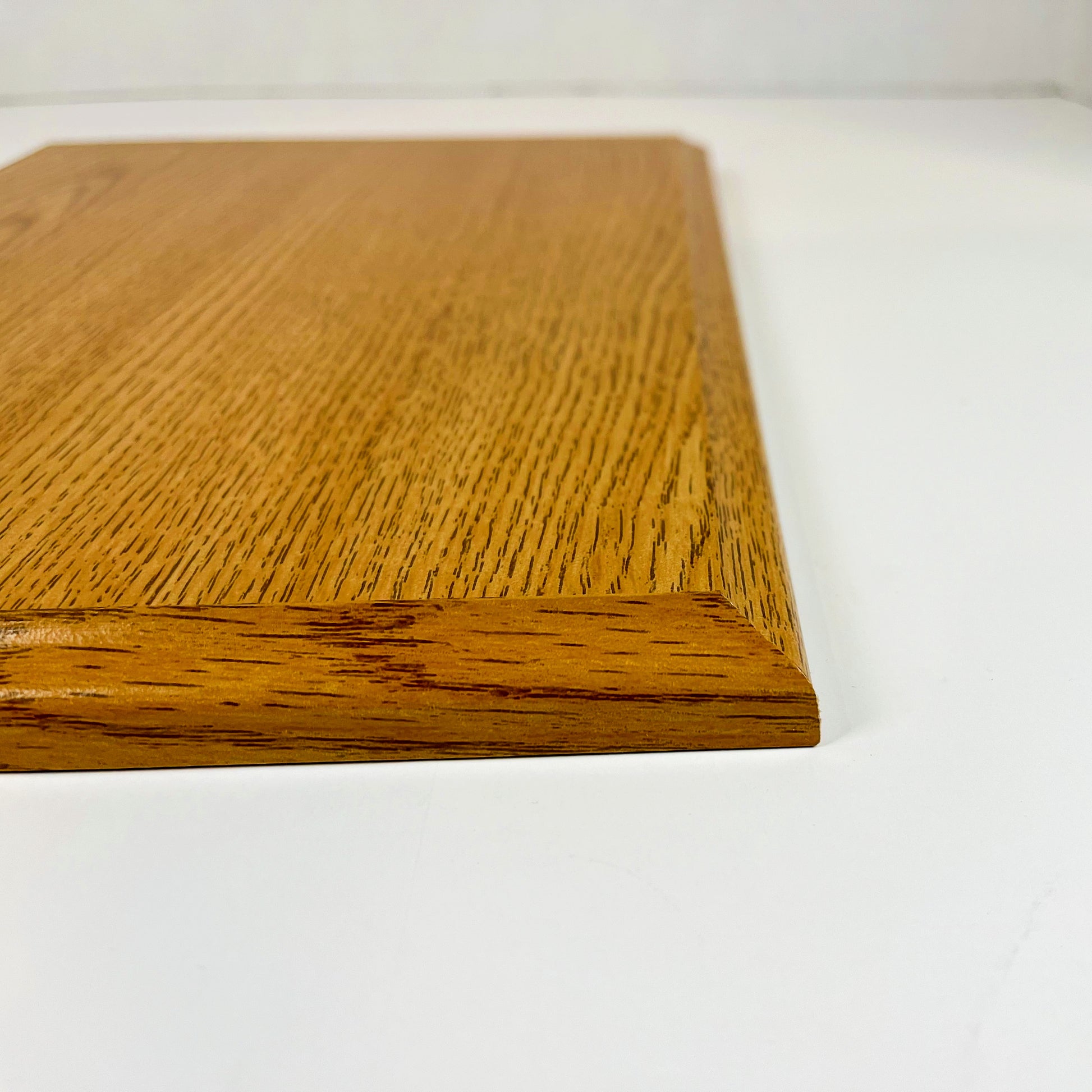profile view of oak finish plaque
